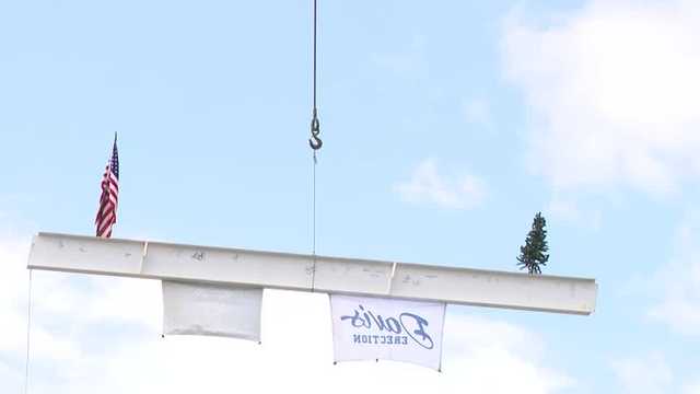 Workers celebrate ‘topping out’ new library 72nd and Dodge streets